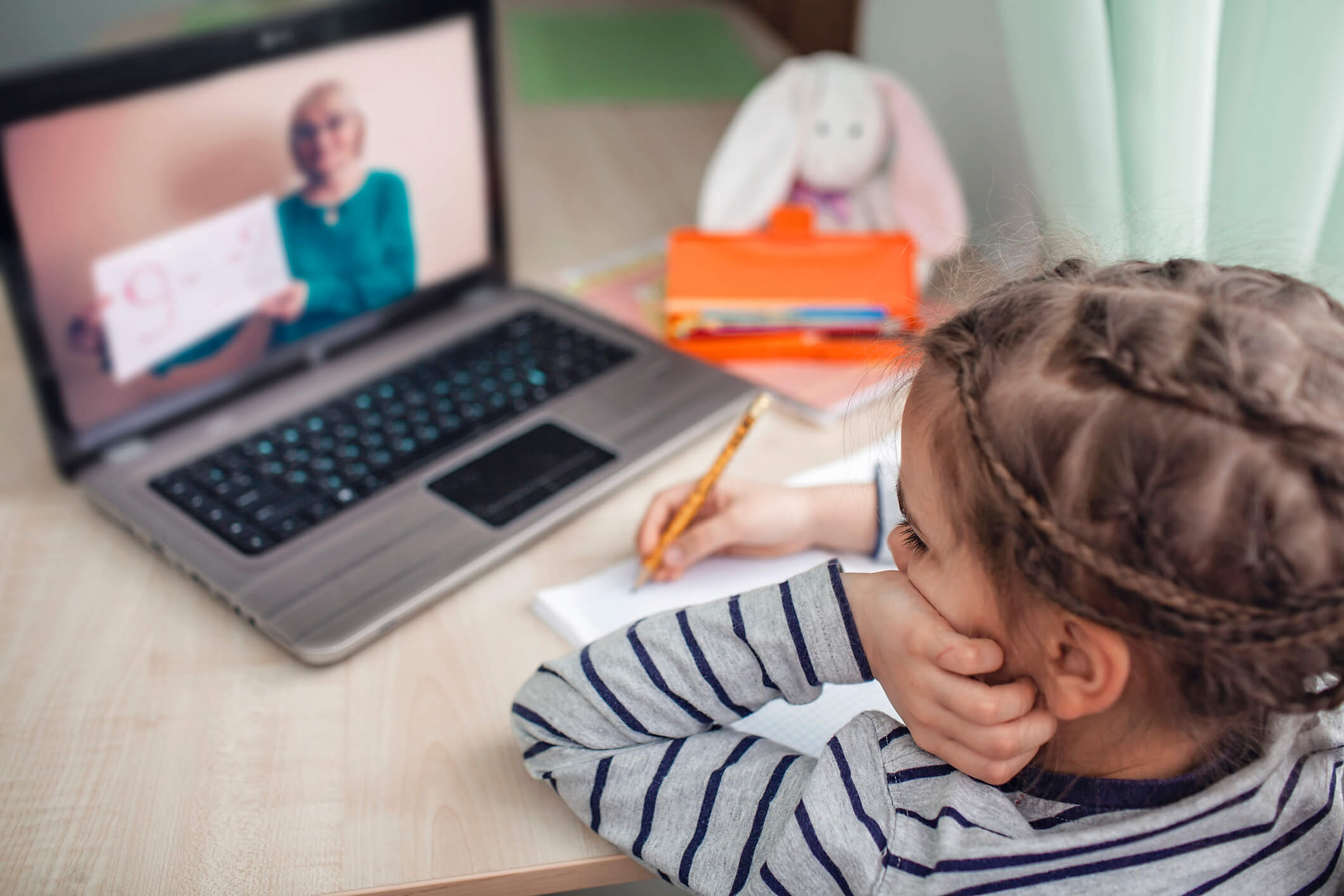 schoolgirl studying math during her online lesson at home